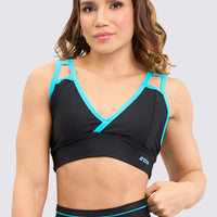 Top deportivo en color negro, y detalles en color azul turquesa, escote en V, frontal, tirantes que ofrecen soporte alto.