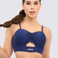 Top deportivo color azul marino, con tirantes y fruncido delantero.