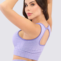 Top seamless, con compresión alta, para ejercicios de alto impacto, y sin costuras para mayor comodidad.