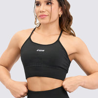 TOP DEPORTIVO SEAMLESS, COLOR NEGRO, CON TIRANTES AJUSTABLES Y COPAS REMOVIBLES.