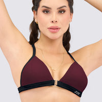 Top deportivo estilo bralette color cerezo oscuro con negro, soporte ligero y cómodo. 