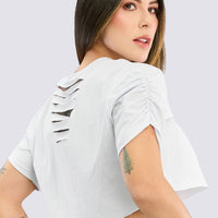 CAMISETA CROP BLANCA CON CORTES TRASEROS RVC