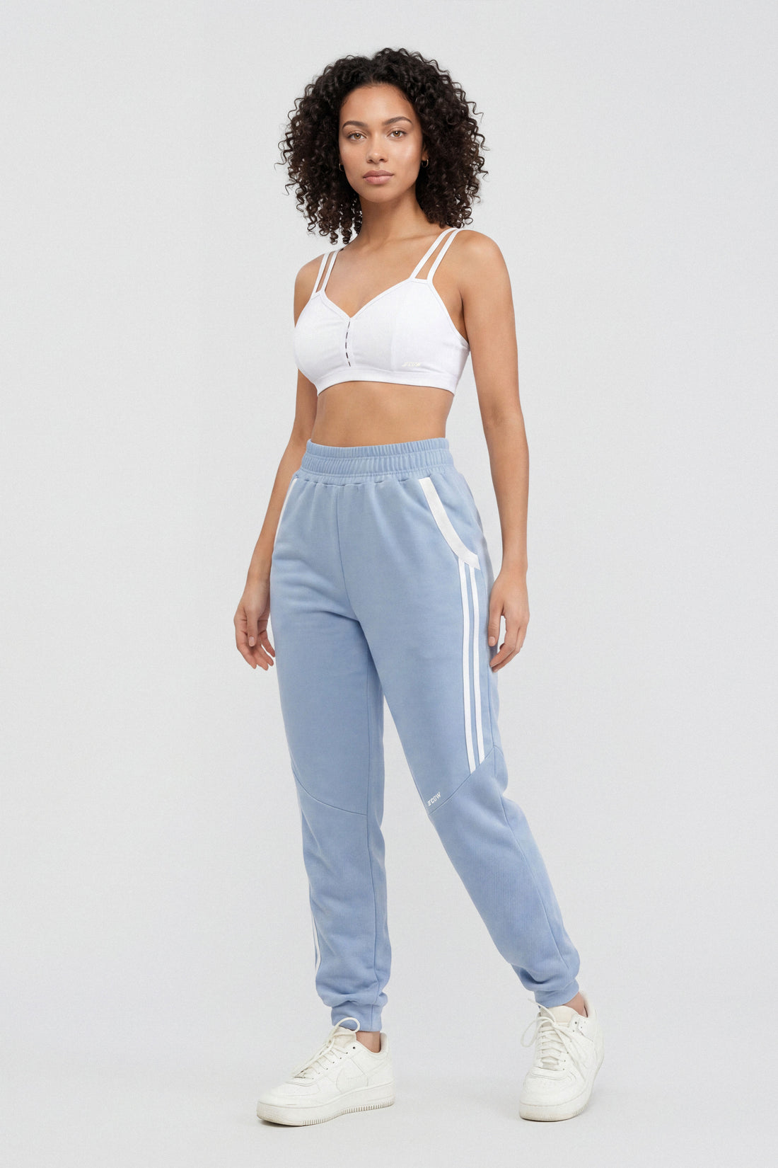 JOGGER BABY BLUE CON FRANJAS LATERALES RVC CDC