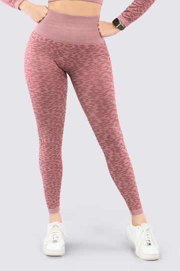 Leggings deportivo color palo de rosa con patrones de animal print. 