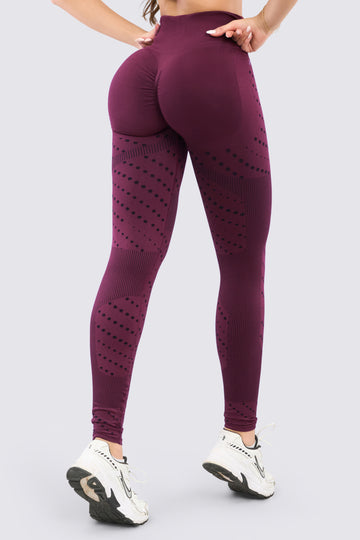 Leggings deportivo seamless vinotinto, de talle alto y patrones de líneas y circulos. 