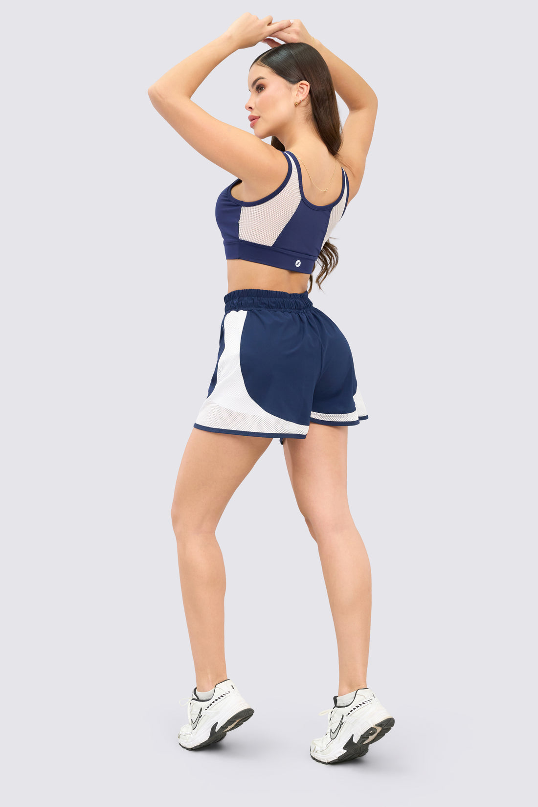 TOP DEPORTIVO AZUL MALLA FRONTAL BLANCA RVC