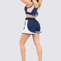 TOP DEPORTIVO AZUL MALLA FRONTAL BLANCA RVC