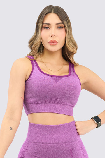 Top seamless color morado, soporte alto, con copas removibles. 