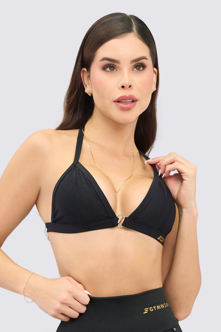 Top deportivo color negro, estilo bralette de soporte ligero perfecto para combinar.
