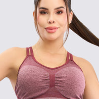 Top sin costuras color Vinotinto, sombreado que estiliza la figura, y alto soporte. 