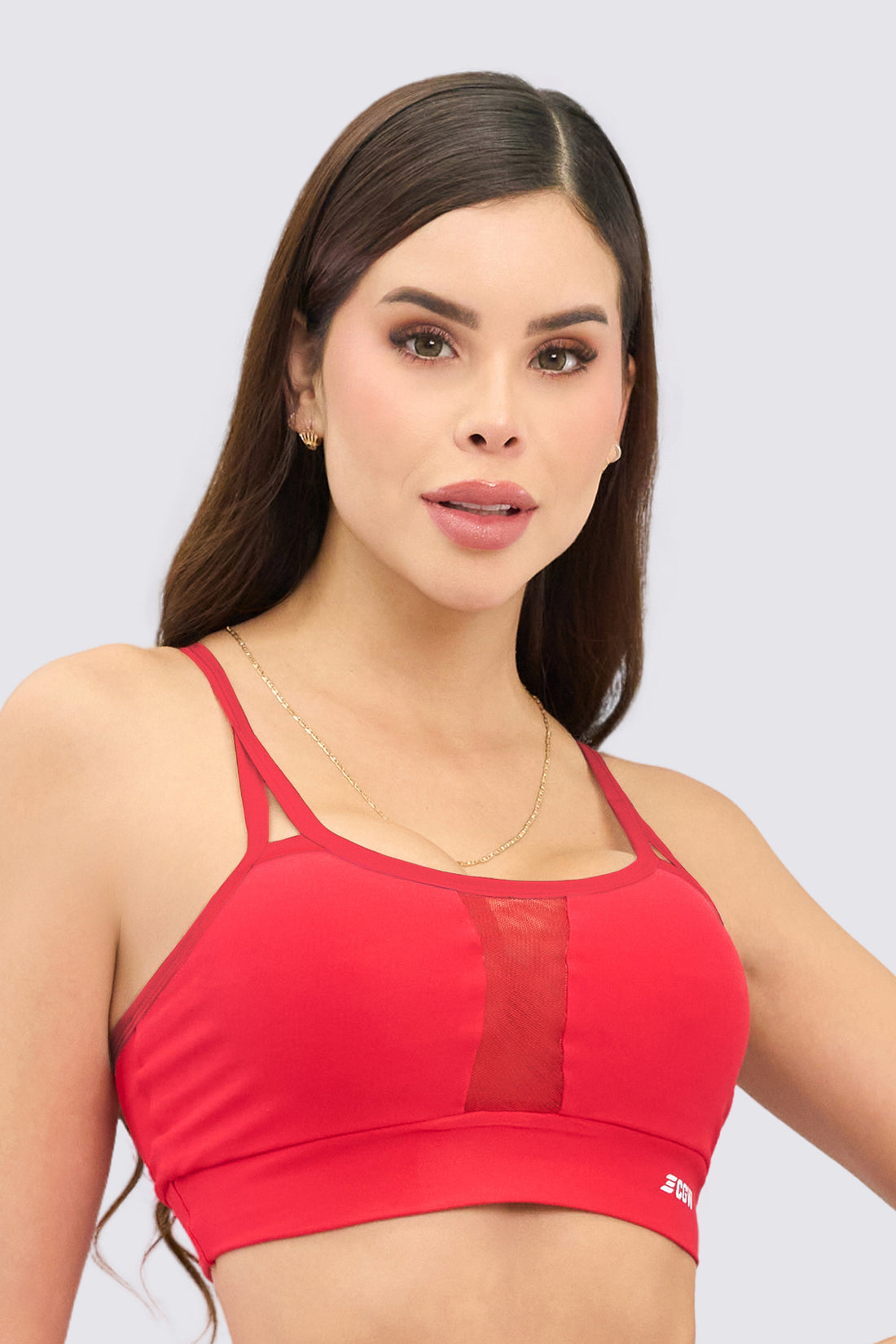 Top deportivo color rojo, con malla frontal transpirable y elástica. 